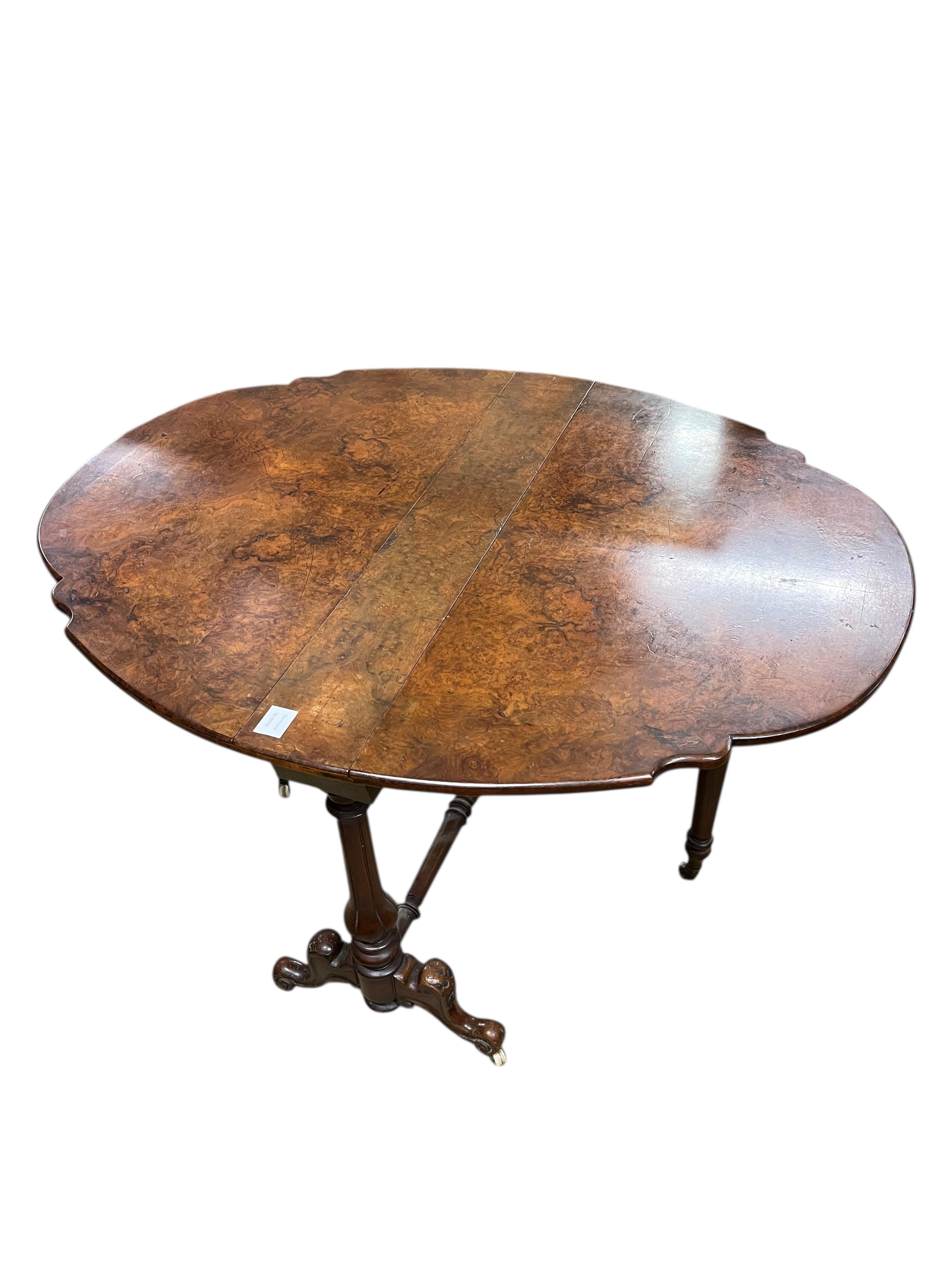 A Victorian walnut Sutherland table, width 92cm, height 68cm